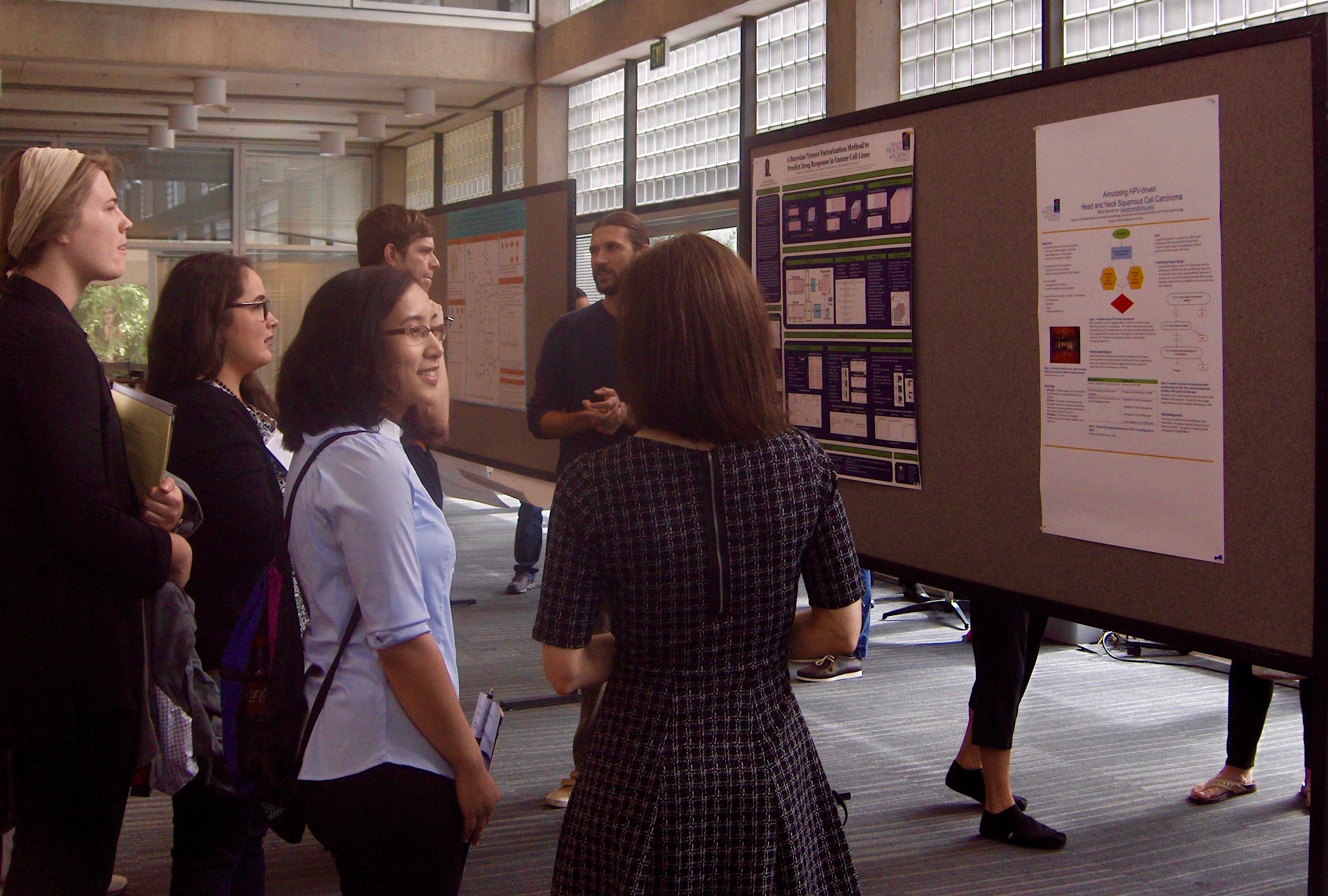 DMICE Students looking at posters