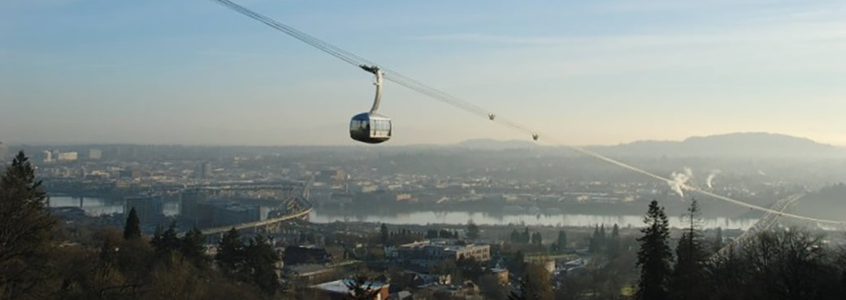 A scenic photo of the OHSU tram shutting up Marquam hill in the morning.