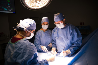 Dr. Brett Sheppard in the operating room performing a surgical procedure