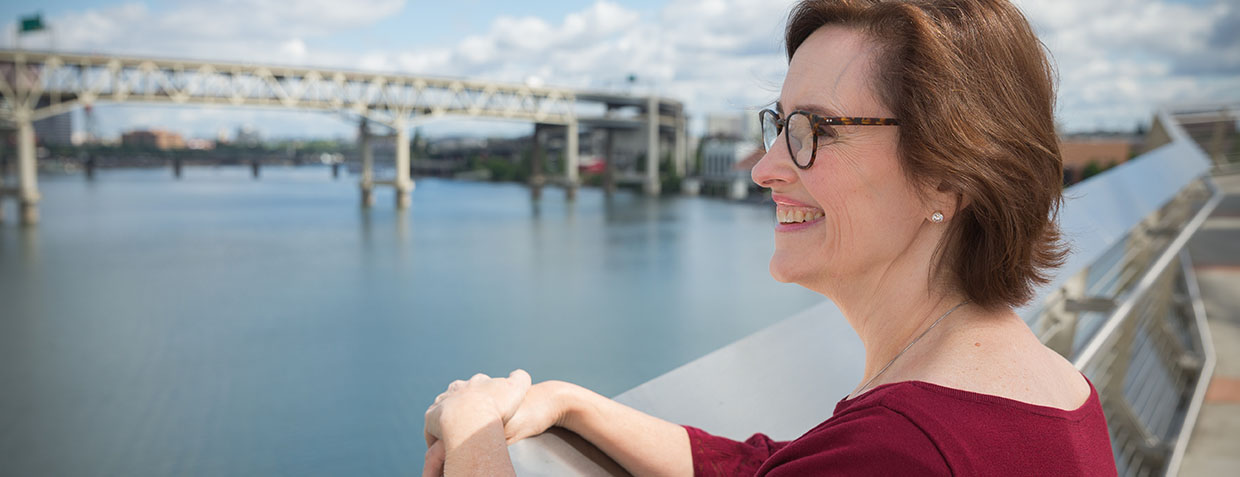 Alisa Brewster looks out on the Willamette River