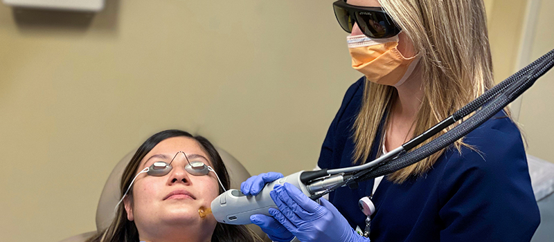 A nurse provides a cosmetic laser treatment