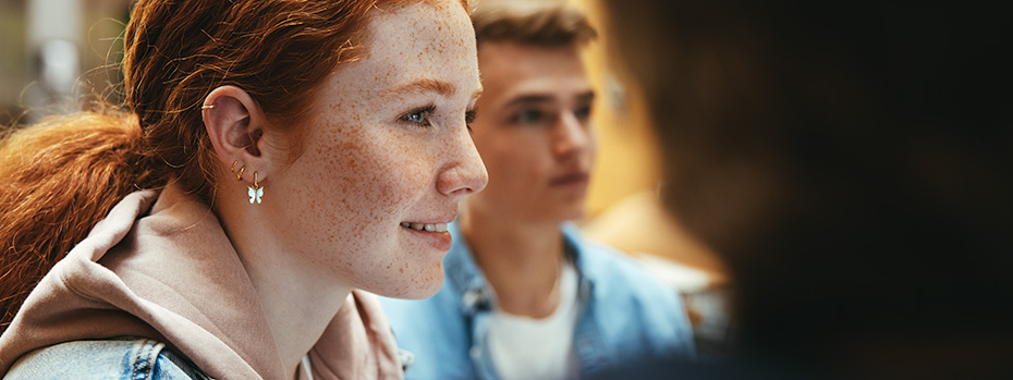 A student smiles while in class.