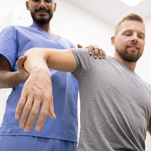 A doctor examines a student patient.