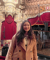 Person with long hair in theatre.