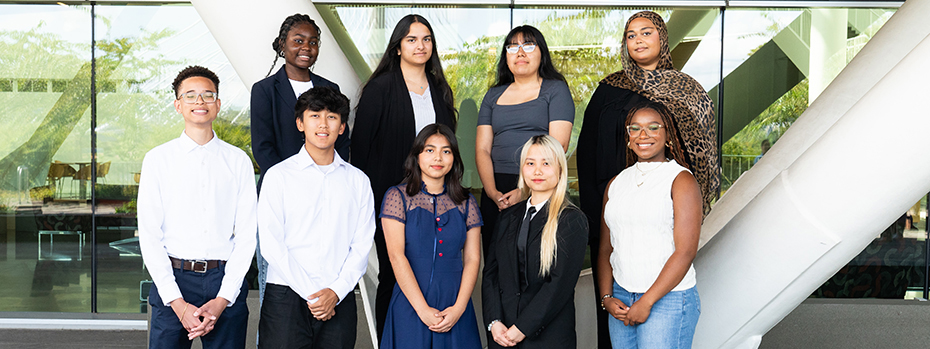 Nine CURE student interns standing outside of the Roberson Life Sciences Building in September 2024.