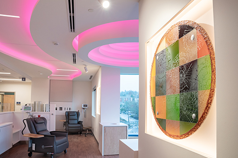 At OHSU’s Molecular Imaging and Therapy Clinic, comfortable recliners for patients face windows and colorful artwork hangs on a wall.