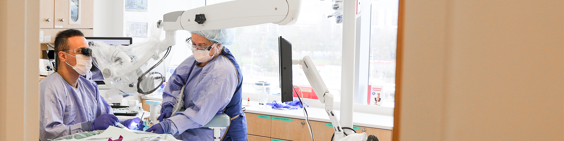 OHSU endodontics resident Dr. Mohammed Kadhem and dental assistant Debbie Taira