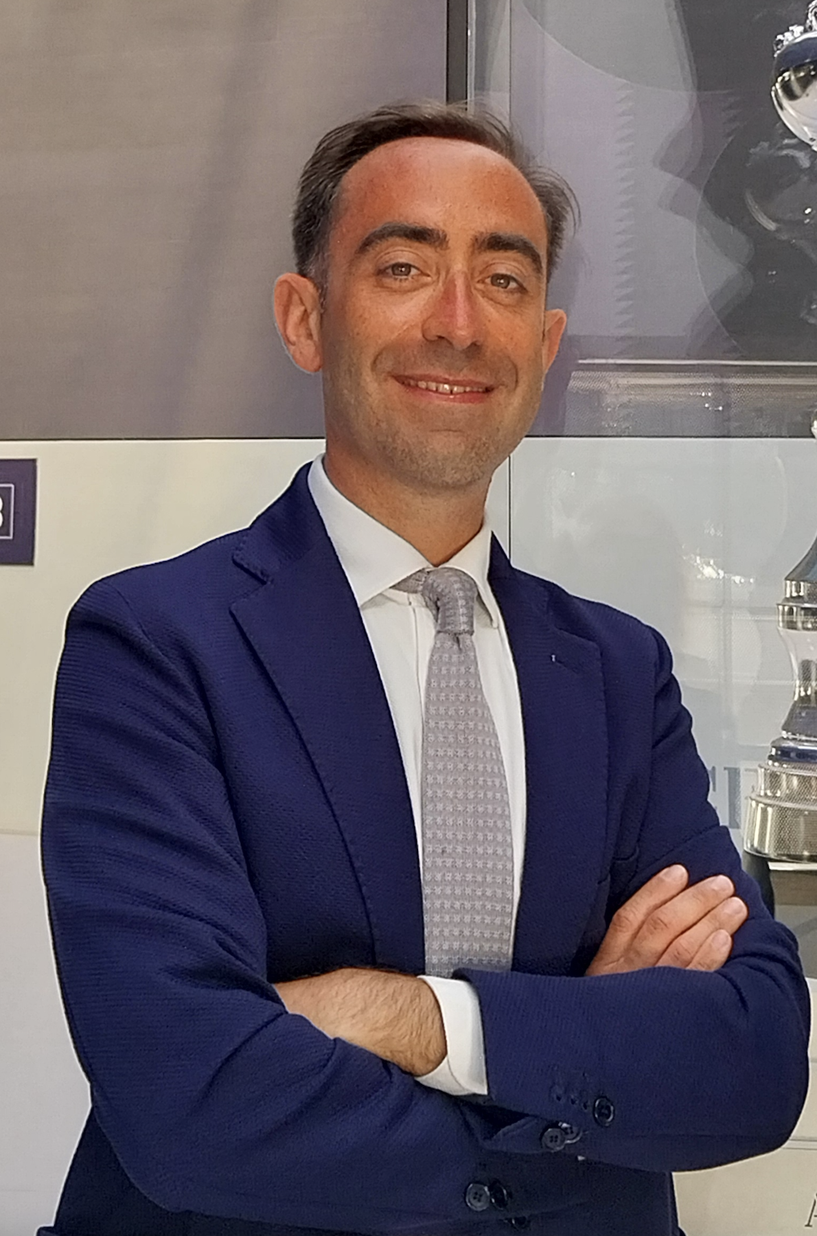 Stefan Sandrone smiles in a blue suit