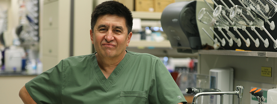 Shoukhrat Mitalipov, Ph.D. stands in a laboratory at OHSU.