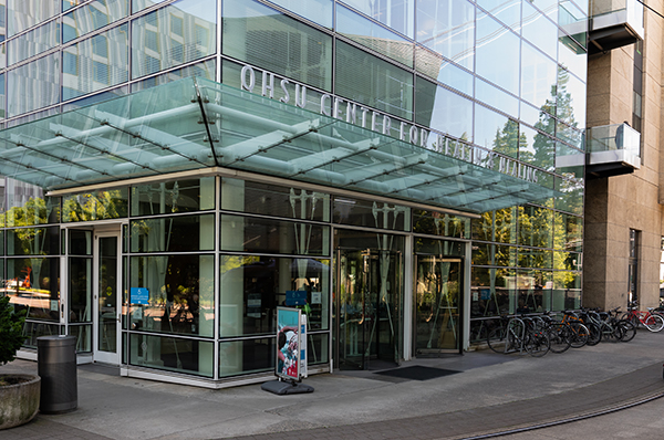 A corner of the OHSU Center for Health & Healing Building 1, showing multiple entrances.