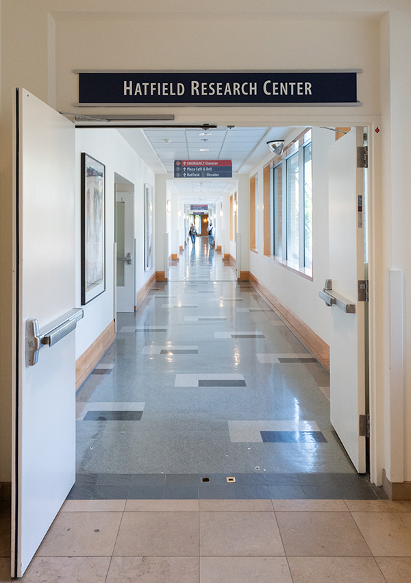 A sign for the Hatfield Research Center over an entrance to a long hallway.