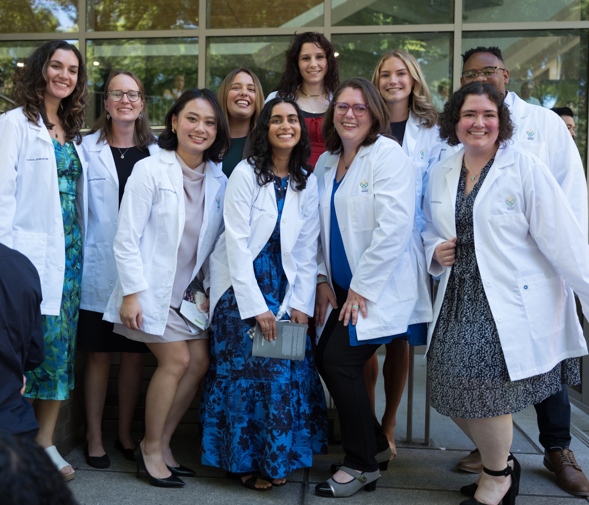 Class of ten people posing for a group picture