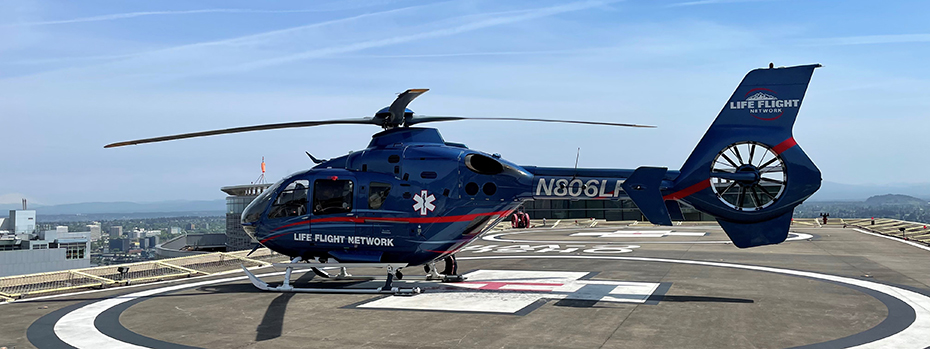 A Life Flight Network helicopter sits on the helipad atop OHSU Hospital.