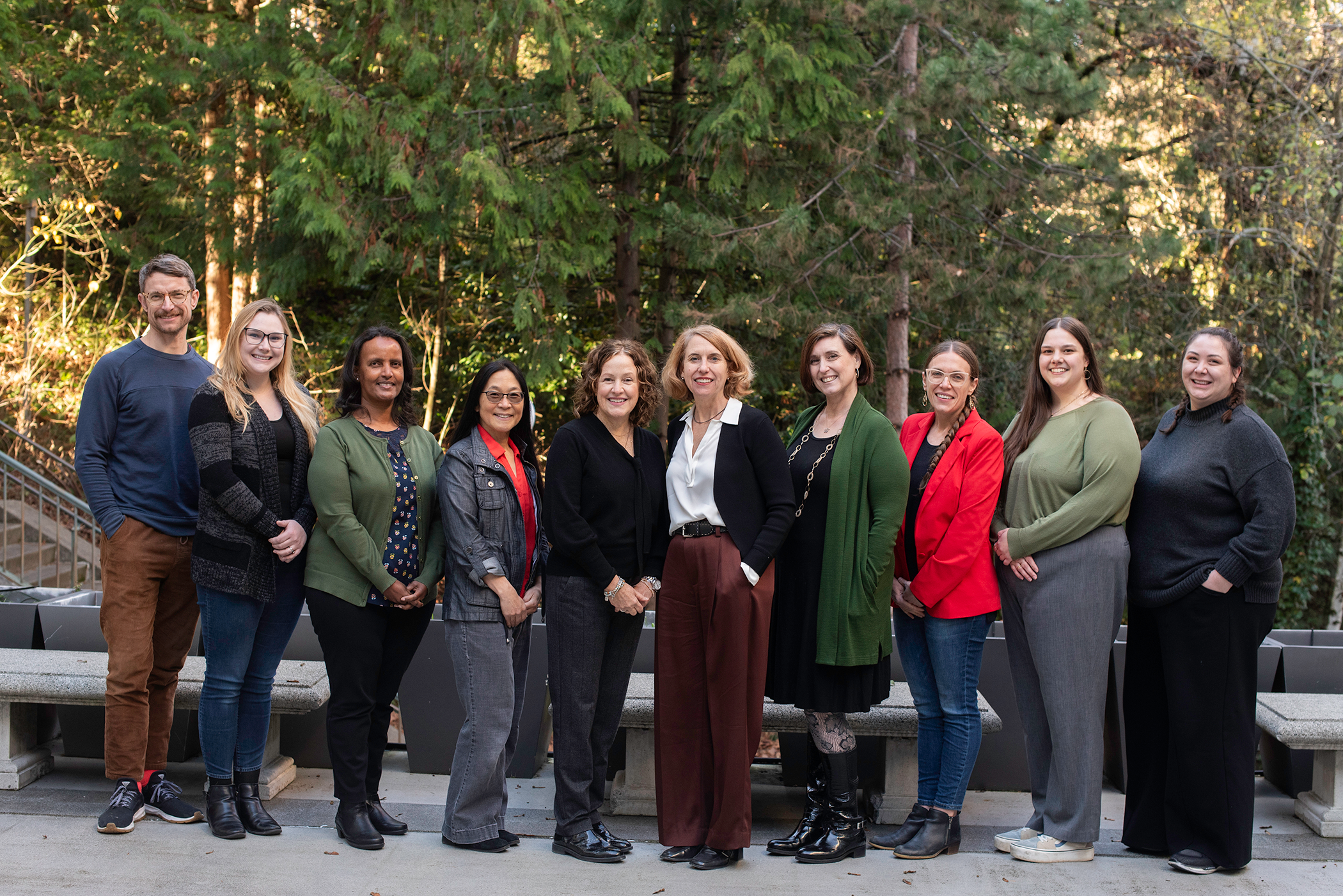 Group photo of the STELLA research team, smiling and standing together in an outdoor setting.