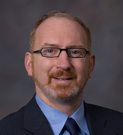 Headshot photo of Dennis Charles Crawford, Ph.D., M.D.