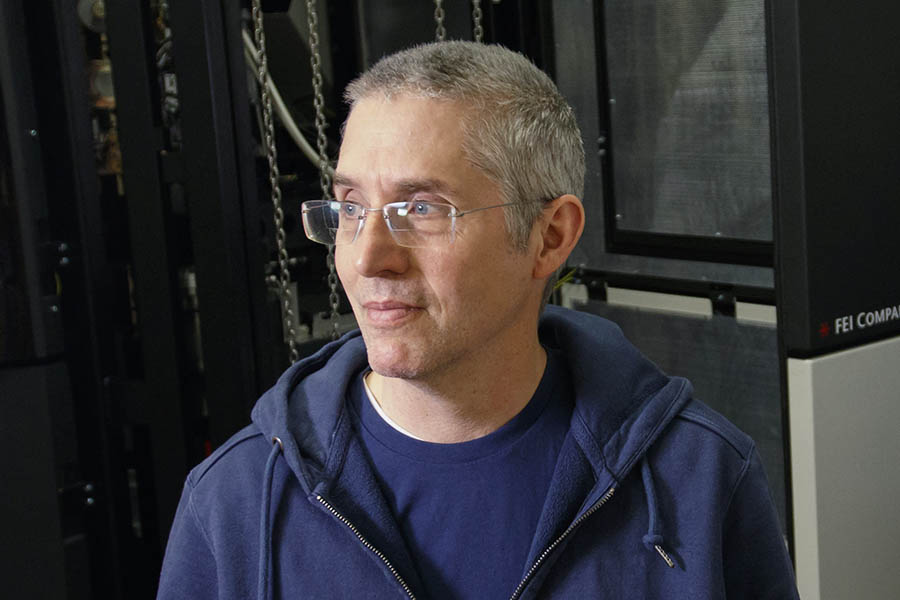 Eric Gouaux, Ph.D., has short gray hair, eye glasses and a blue hooded sweatshirt.
